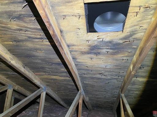 Queens home attic rafters before professional mold remediation